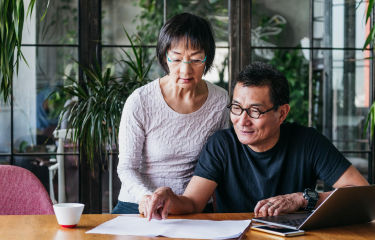 Man and woman looking at the documents