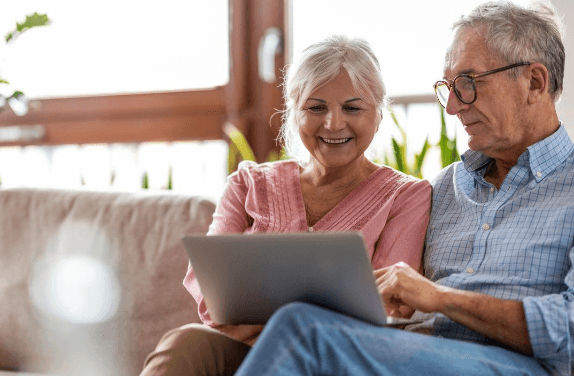 Mature couple looking at the laptop