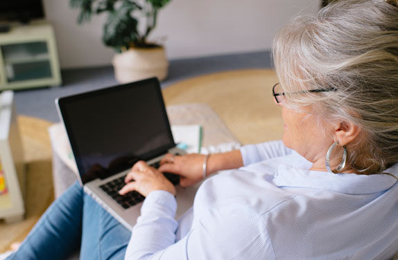 mature woman working on laptop