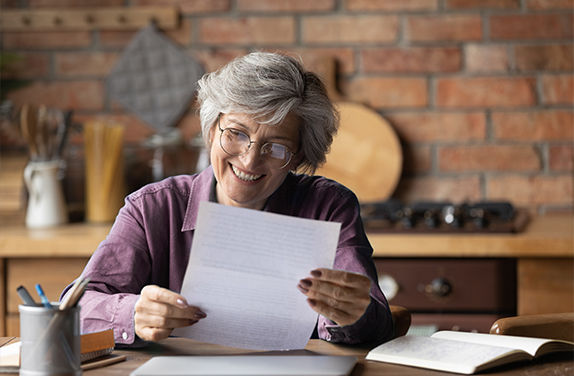 Lady smiling at letter